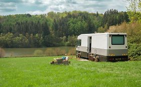 Converted Library Bus With Views Over Reservoir In Sussex Countryside